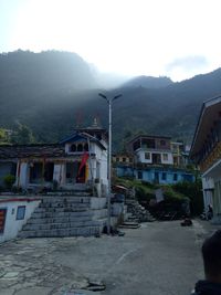 Scenic view of residential district against sky