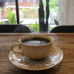 Close-up of coffee cup on table