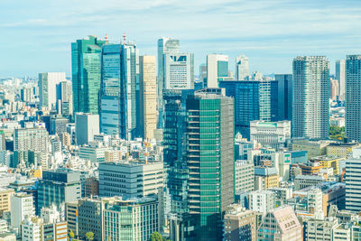 High angle view of buildings in city against sky