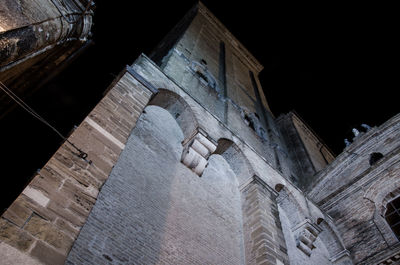Low angle view of old building at night