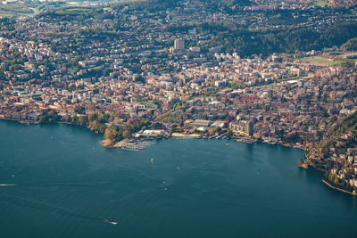 High angle view of lake amidst buildings in city