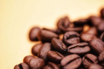 Close-up of coffee beans on table