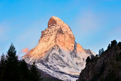 Scenic view of mountains against clear blue sky