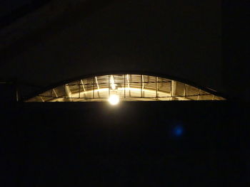 Low angle view of illuminated built structure at night