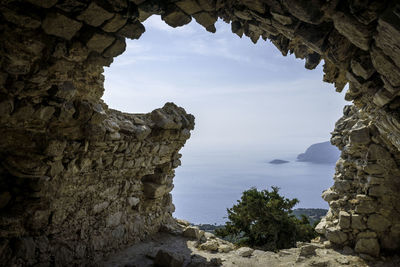 Scenic view of sea against sky seen from abandoned structure