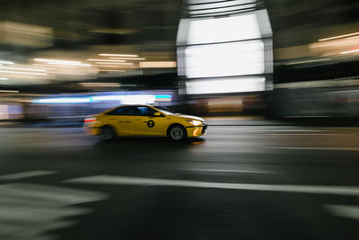 Blurred motion of car on road at night