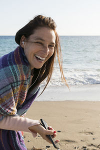 Woman smiling at beach