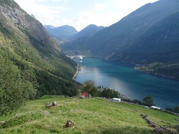 Scenic view of lake and mountains against sky