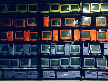 Full frame shot of computers in shelves