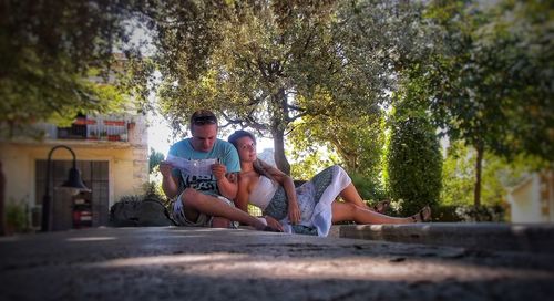 Friends sitting on tree