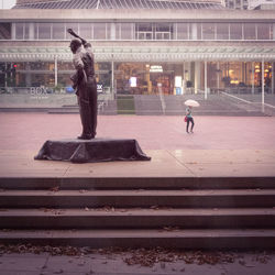 People in front of modern building