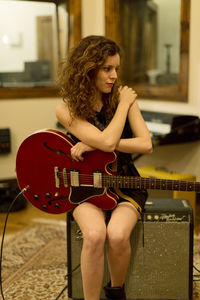 Portrait of a young female guitarist