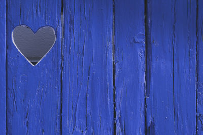 Heart shape on blue wall