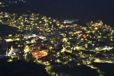 High angle view of illuminated buildings at night