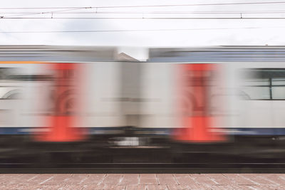 Blurred motion of train at railroad station