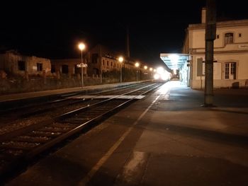 View of illuminated railroad tracks at night