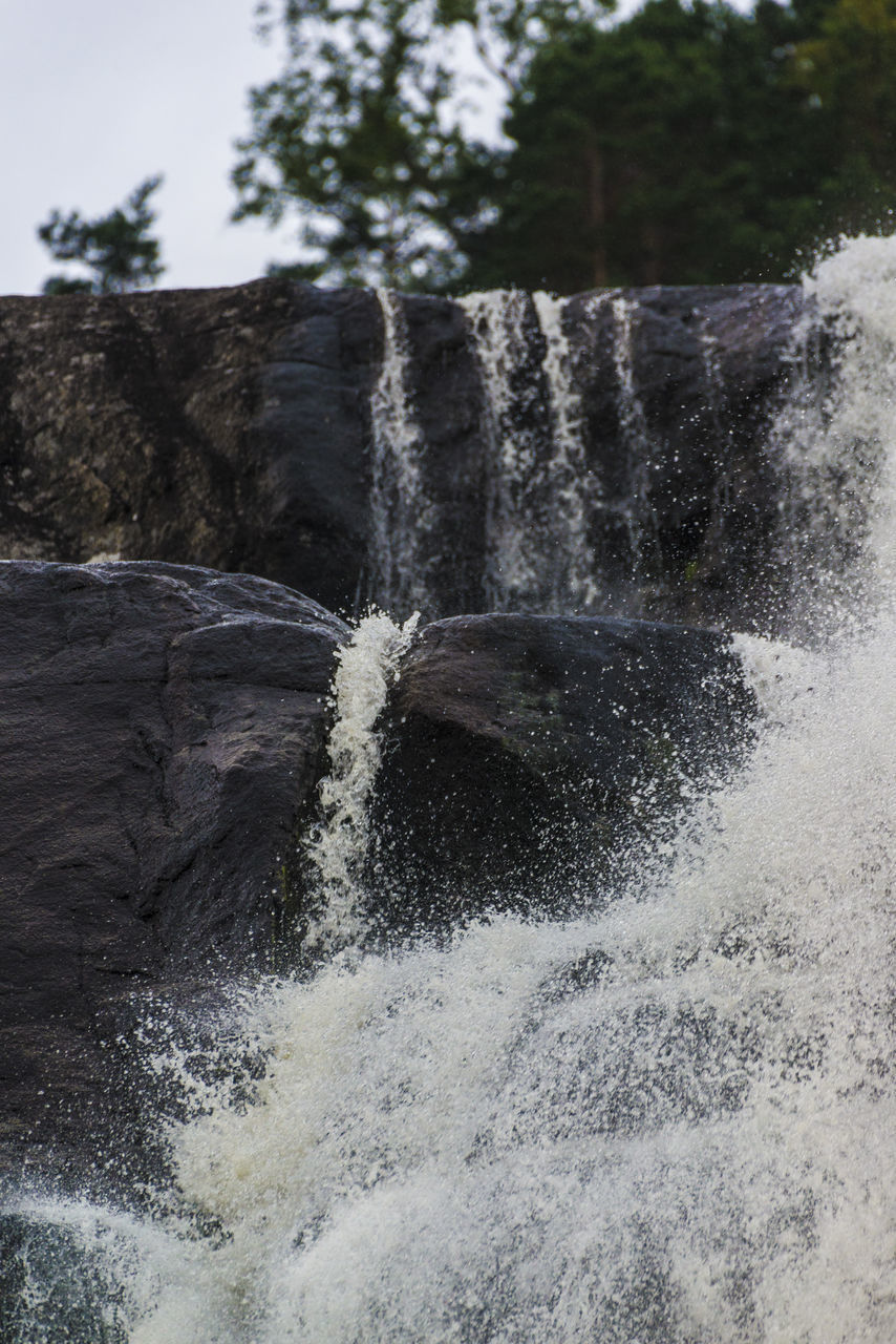 WATER SPLASHING ON ROCK