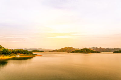 Scenic view of lake against sky during sunset