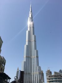 Low angle view of skyscrapers against clear sky