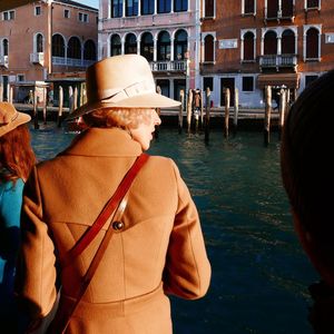 Rear view of men standing in water