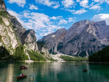 Scenic view of lake and mountains against sky