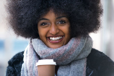 Portrait of smiling woman in snow