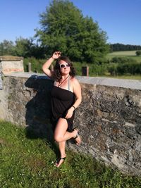 Full length of woman standing on field