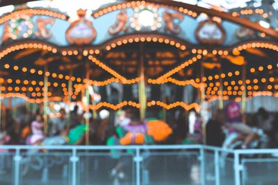 Illuminated carousel at amusement park