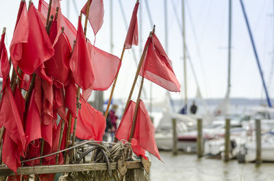 Red flags in boat at harbor