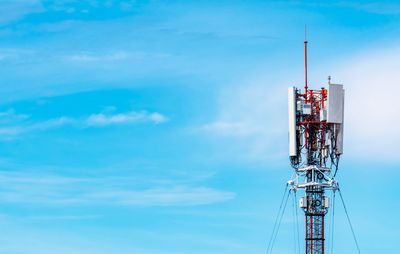 Telecommunication tower with blue sky and white clouds background. antenna on blue sky. 