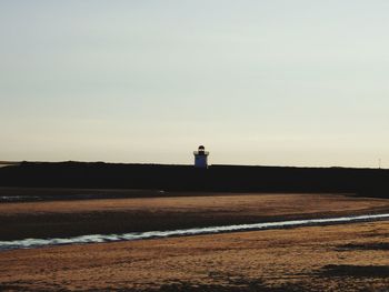 Lighthouse on landscape