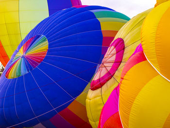Low angle view of multi colored hot air balloons