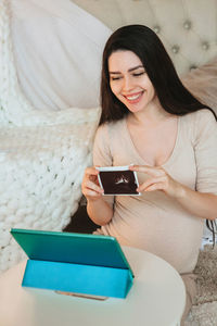 Young woman using phone