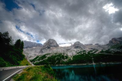 Scenic view of mountains against cloudy sky