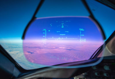 View of sky seen through car window