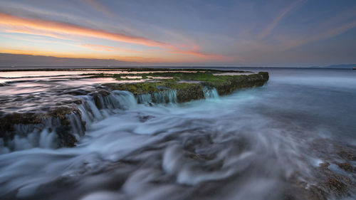 Scenic view of sea against sky during sunset