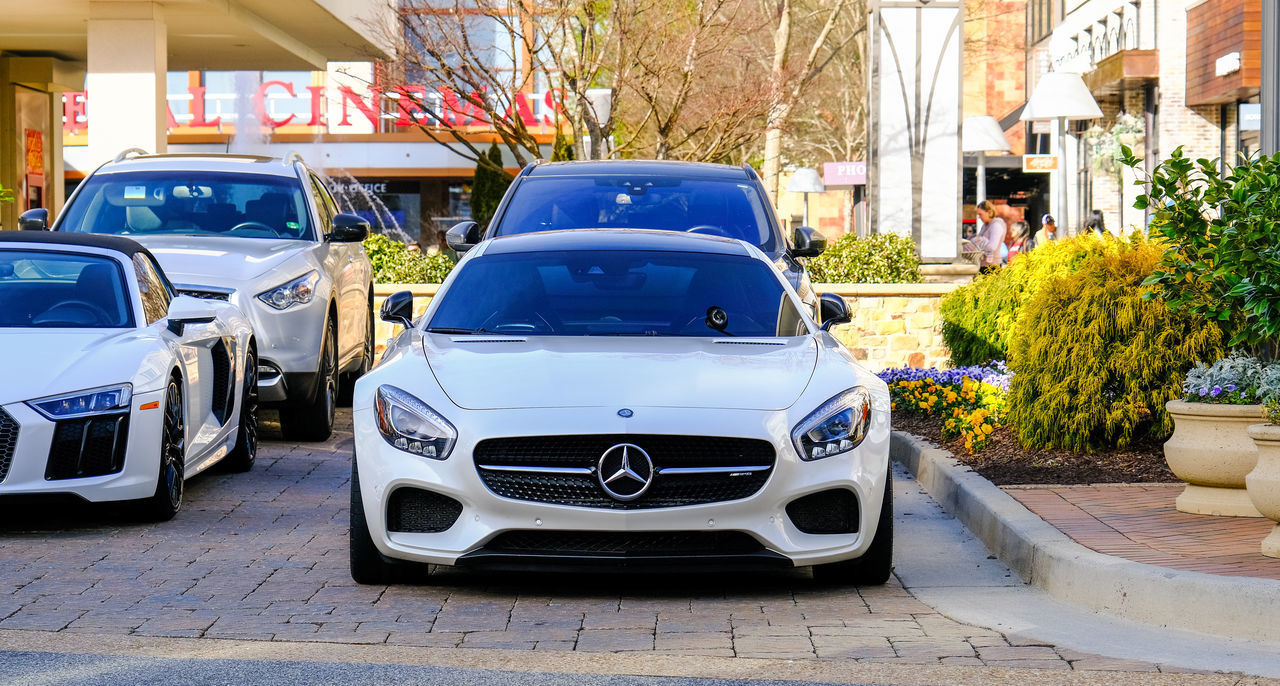 VIEW OF CARS ON STREET IN CITY