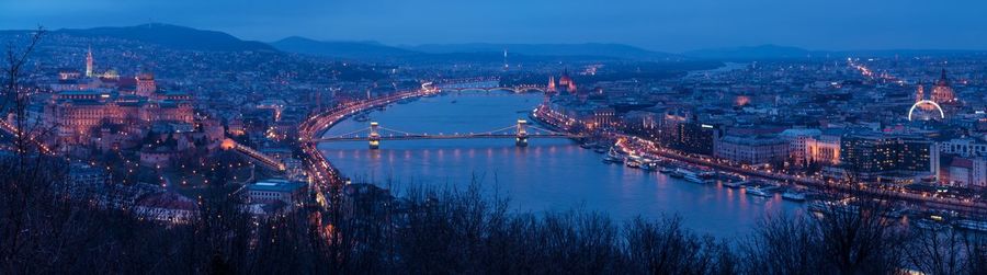 Aerial view of bridge over river at dusk
