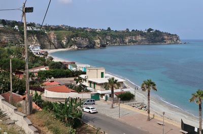 High angle view of swimming pool by sea against sky