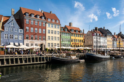 Boats in sea against sky
