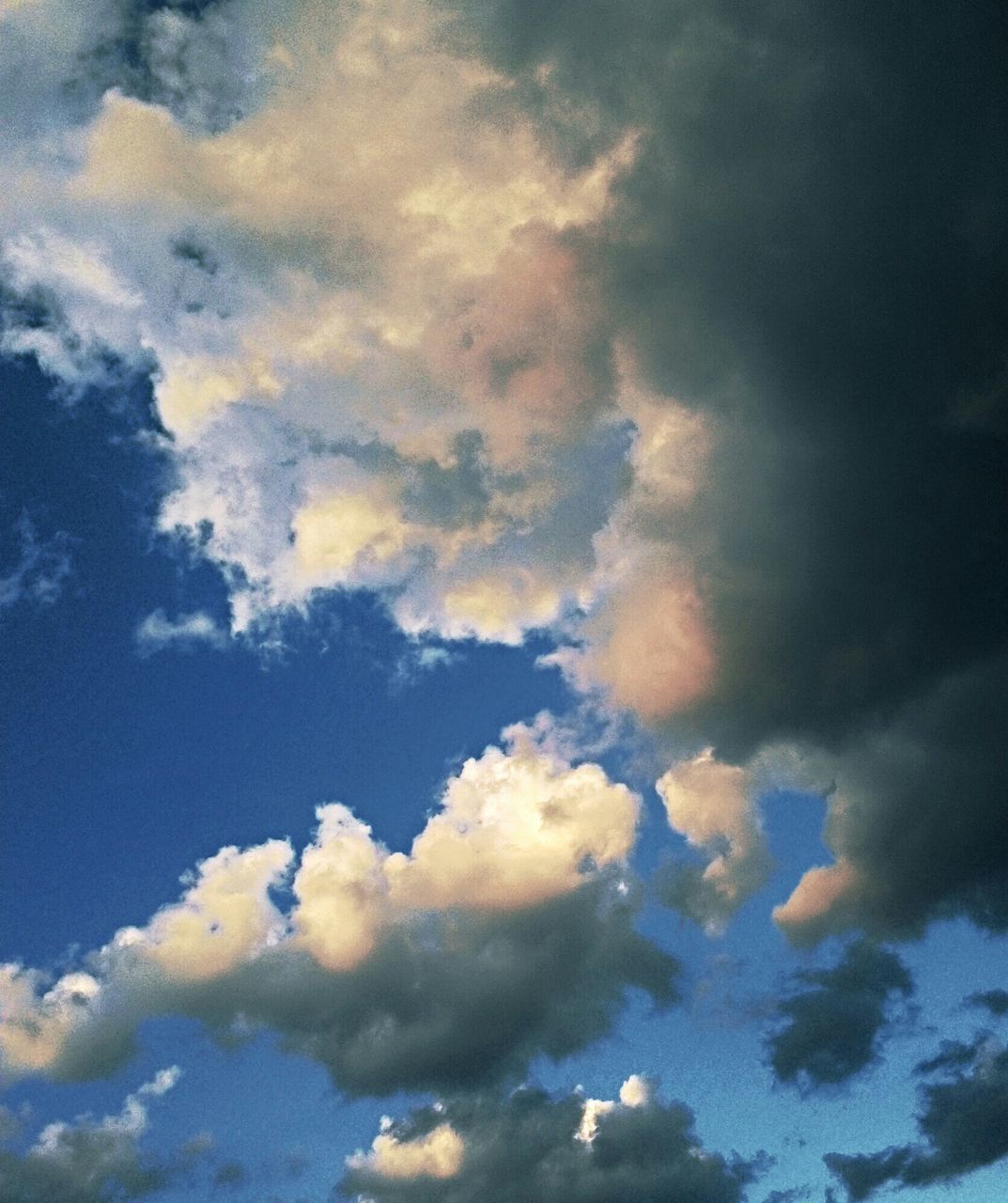 sky, cloud - sky, low angle view, cloudy, sky only, beauty in nature, tranquility, scenics, cloudscape, nature, tranquil scene, backgrounds, blue, cloud, full frame, weather, idyllic, majestic, outdoors, no people