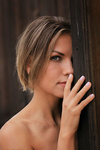 Close-up portrait of beautiful woman standing outdoors