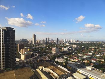 High angle view of modern buildings in city against sky