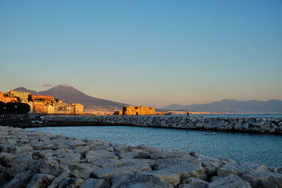 Scenic view of sea against clear sky during sunset