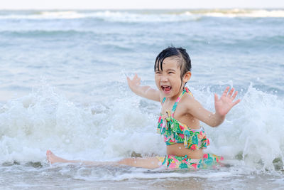 Boy enjoying at sea shore