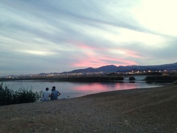 Scenic view of lake against sky during sunset