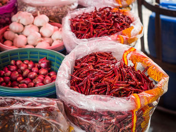 Close-up of red chili pepper for sale at market stall