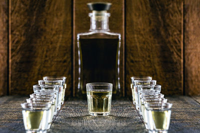 Close-up of wine glasses on table