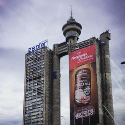 Low angle view of clock tower against sky in city