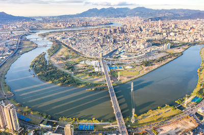 High angle view of river amidst buildings in city